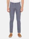 Man wearing a navy navy solid casual trouser with casual styling on a gray background