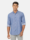 Man wearing a blue casual printed blue full sleeve 100% cotton shirt on a light gray background