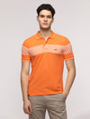 Man wearing a slim fit signature peach t shirt for trendy comfort with casual styling on a gray background