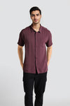 Man wearing a red red crinkled fluid shirt relax fit relaxed fit shirts on a light gray background