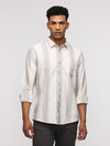 Man wearing a beige comfort fit sport beige shirt for elegant style with casual styling on a gray background
