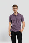 Man wearing a beige beige self-texture polo slim fit polo t shirt on a light gray background