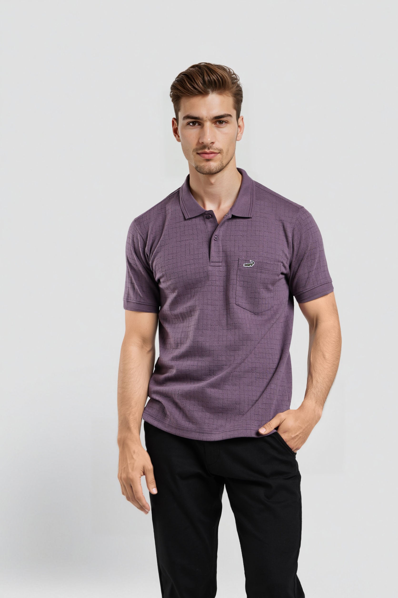 Man wearing a purple polo shirt with a logo on a light gray background