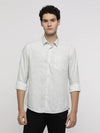 Man wearing a white white printed fluid shirt on a light gray background