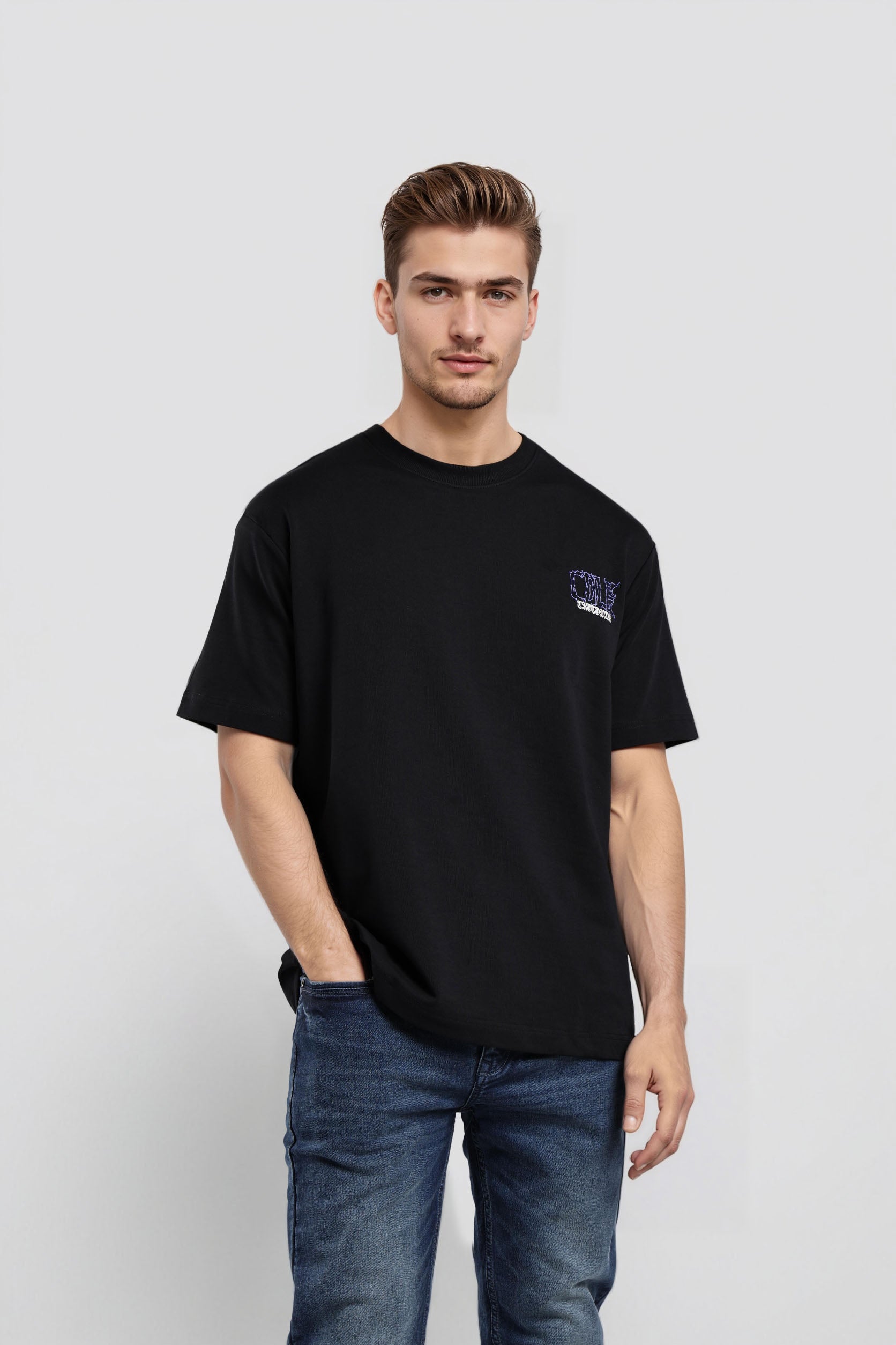 Man wearing a black t-shirt with a logo on a white background