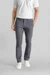 Man wearing a grey grey classic chambray fabric tri-blend stitch detailings slim fit trousers on a light gray background