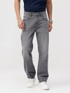 Man wearing a grey grey twill straight fit jeans with casual styling on a gray background