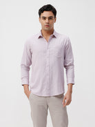 Man wearing a red rib textured cotton shirt light purple on a light gray background