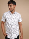 Man wearing a white white printed half sleeve 100% cotton shirt with casual styling on a gray background
