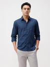 Man wearing a blue blue textured cozy feel cotton comfort fit shirts with casual styling on a gray background