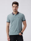 Man wearing a retro classic checked all over printed polo t shirt with casual styling on a gray background