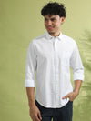 Man wearing a white white solid full sleeve 100% cotton shirt with casual styling on a gray background