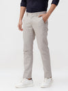 Man wearing a grey ridged premium chinos light grey with casual styling on a gray background