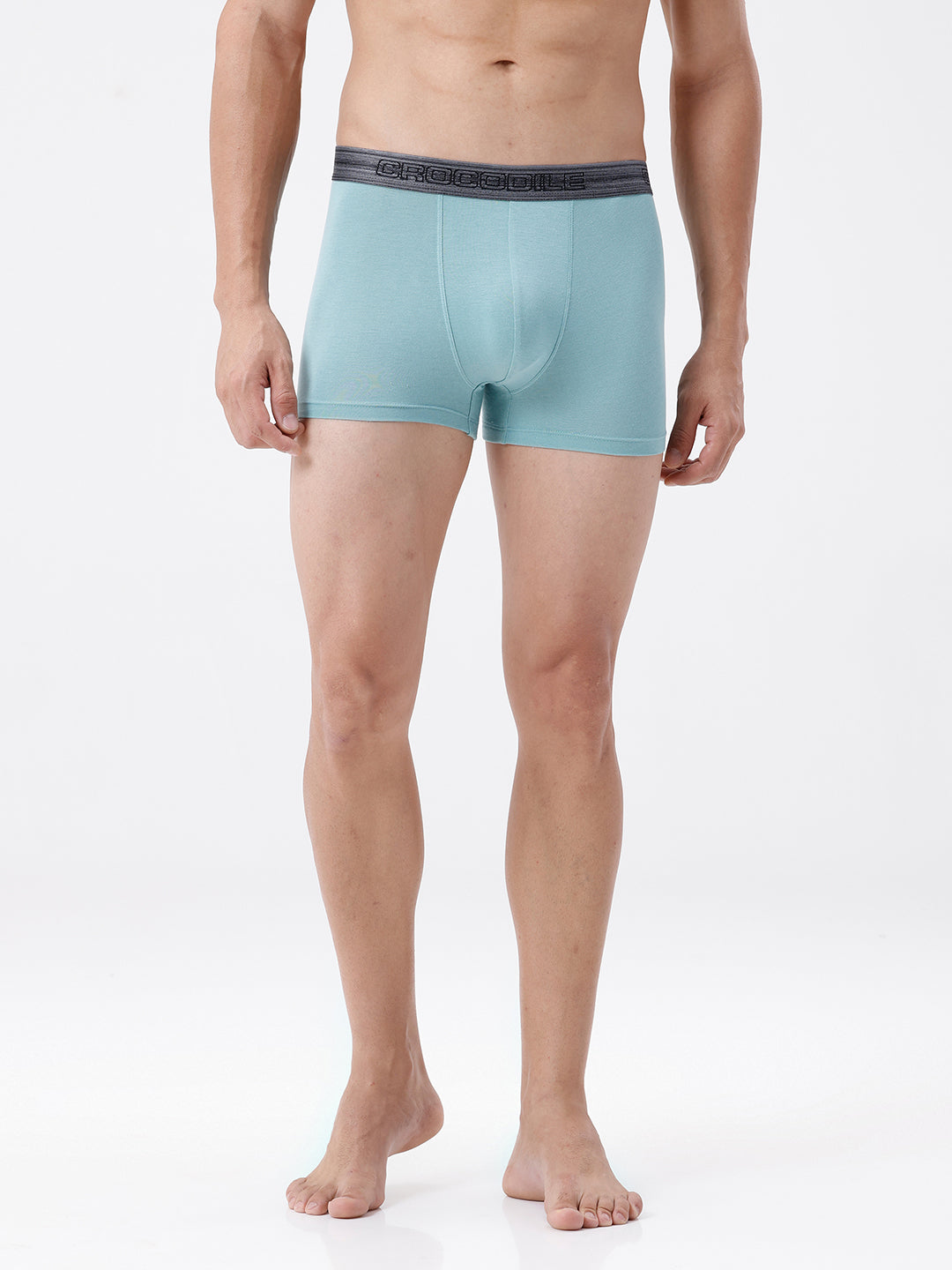Person wearing light blue boxer briefs with a dark waistband on a white background