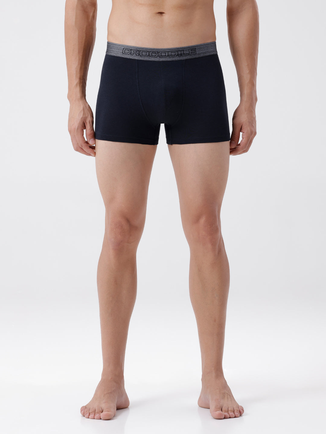 Man wearing black boxer briefs on a white background