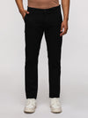 Man wearing a black slim fit sport black trouser for comfortable style with casual styling on a gray background