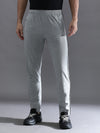 Man wearing a grey solid grey melange slim fit track pant on a light gray background