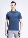 Man wearing a blue denim melange blue solid polo t shirt with pocket with casual styling on a gray background