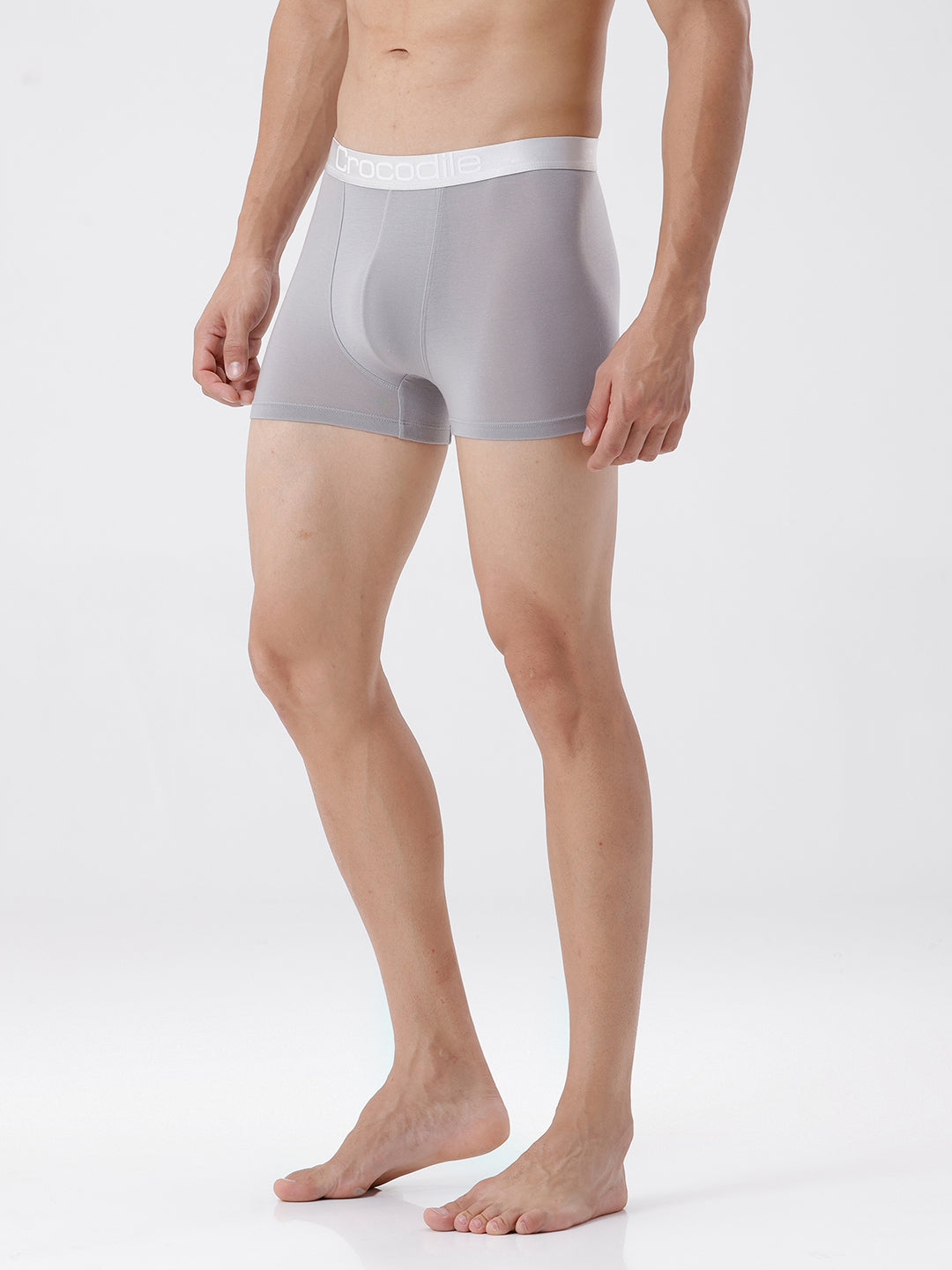 Person wearing gray boxer briefs on a white background