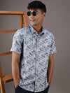 Man wearing a grey grey printed half sleeve 100% cotton casual shirt with casual styling on a gray background