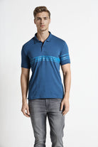 Man wearing a blue polo shirt with a brand logo on a white background