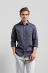Man wearing a grey grey diamond texture fabric cotton comfort fit shirts on a light gray background