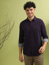 Man wearing a brown wine brown printed full sleeve 100% cotton shirt on a light gray background
