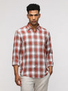 Man wearing a comfort fit sport burnt orange shirt for bold style with casual styling on a gray background