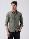 Man wearing a red pure cotton textured shirt light olive on a light gray background