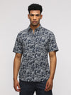 Man wearing a navy comfort fit sport navy shirt for stylish comfort with casual styling on a gray background