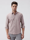 Man wearing a red pure cotton textured shirt peach with casual styling on a gray background