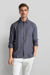Man wearing a grey grey fluid shirt clean attire comfort fit shirts on a light gray background