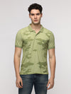 Man wearing a garment dyed sporty sage slim t shirt with 100% cotton with casual styling on a gray background