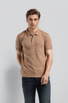 Man wearing a brown self-texture fit brown polo t shirt on a light gray background