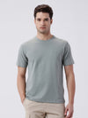 Man wearing a classic stretch crewn neck t shirt on a light gray background