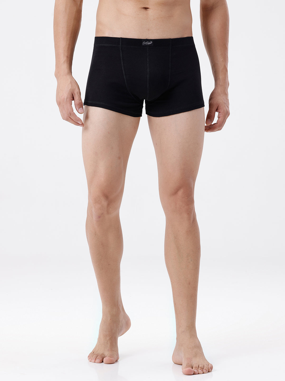 Person wearing black boxer briefs on a white background