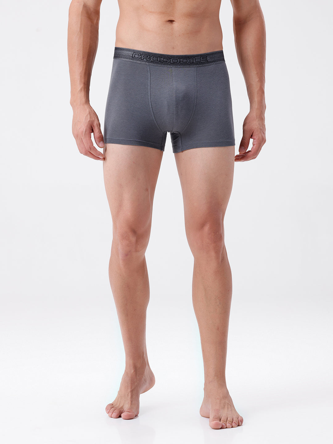 Man wearing gray boxer briefs on a white background
