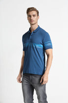 Man wearing a blue polo shirt with a white background