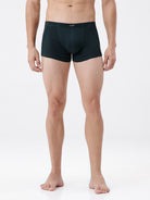 Person wearing black boxer briefs on a white background