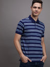 Man wearing a blue striped blue casual polo t shirt on a light gray background