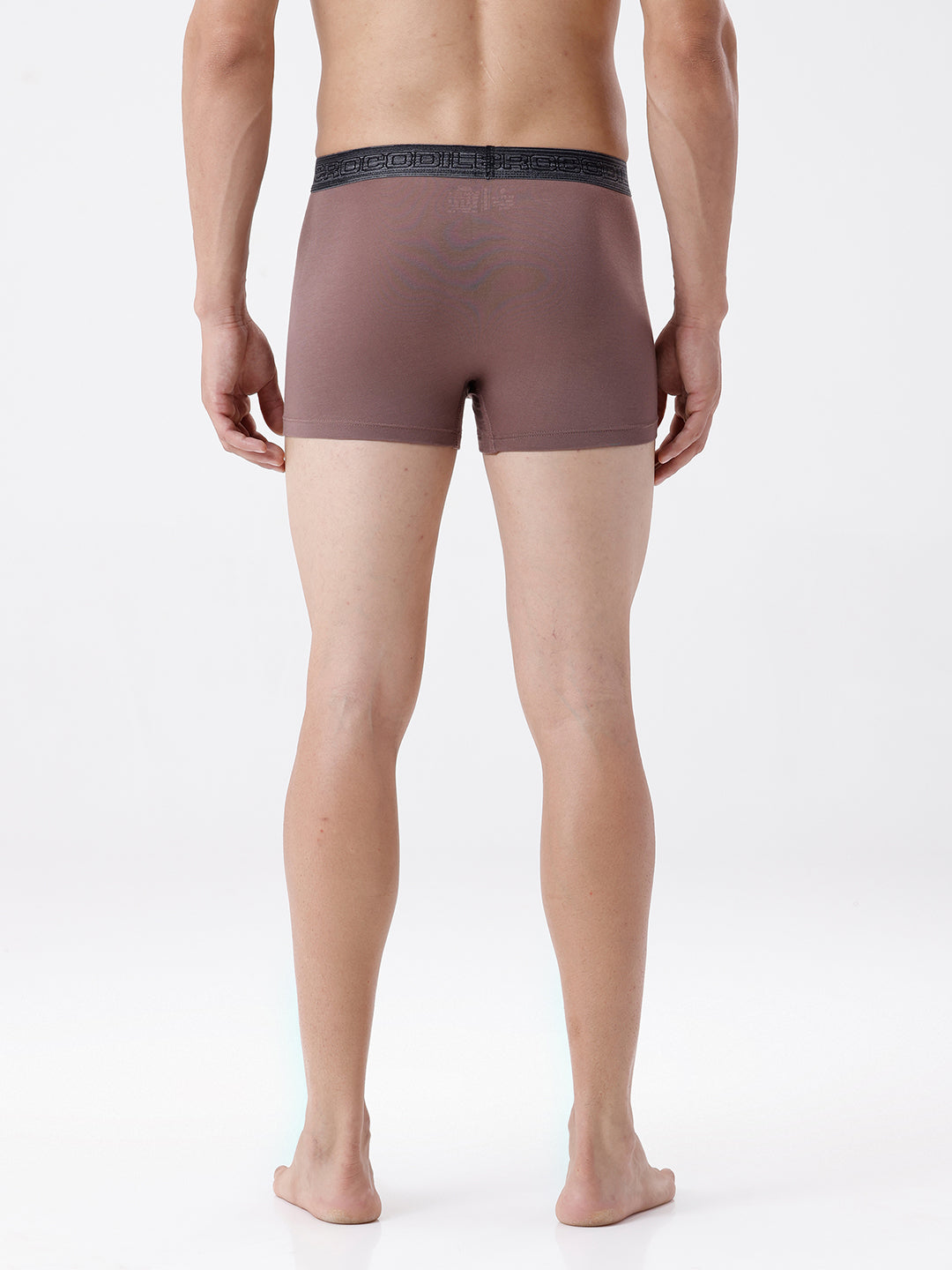 Man wearing brown boxer briefs on a white background