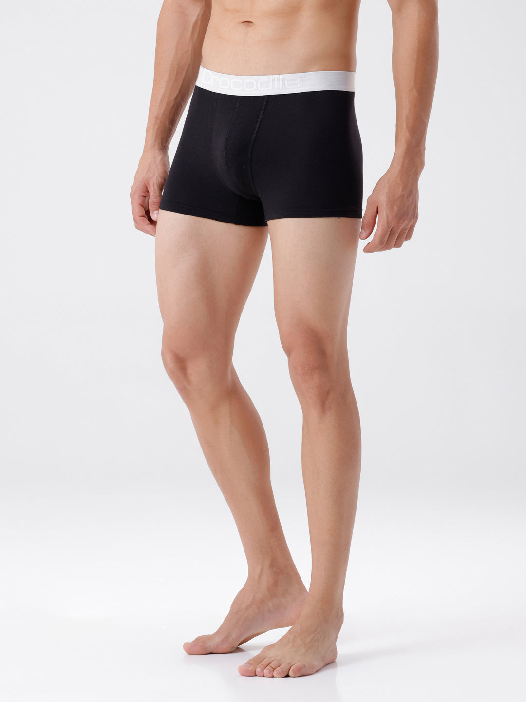 Person wearing black boxer briefs with white waistband on a white background