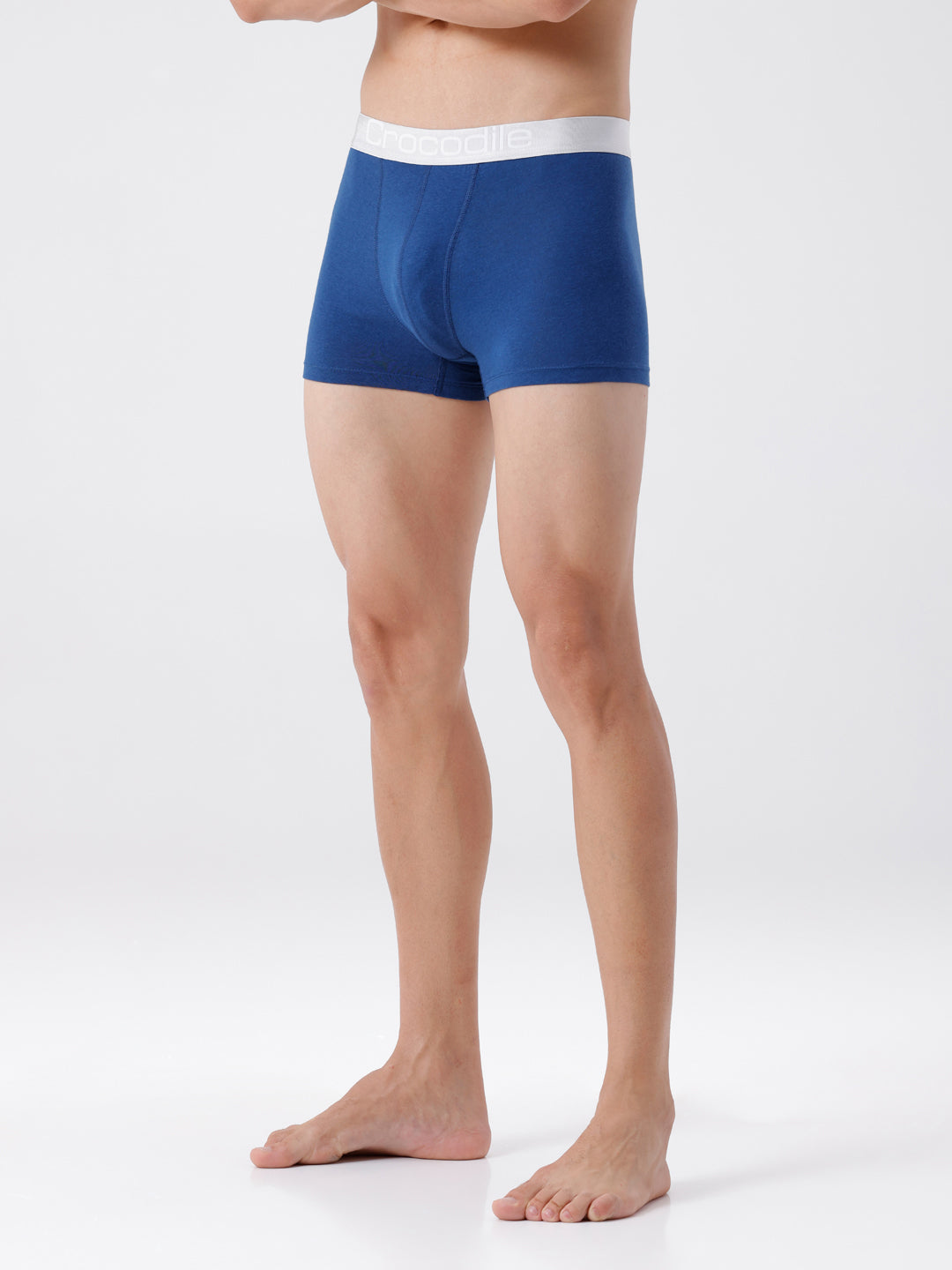 Person wearing blue boxer briefs on a white background