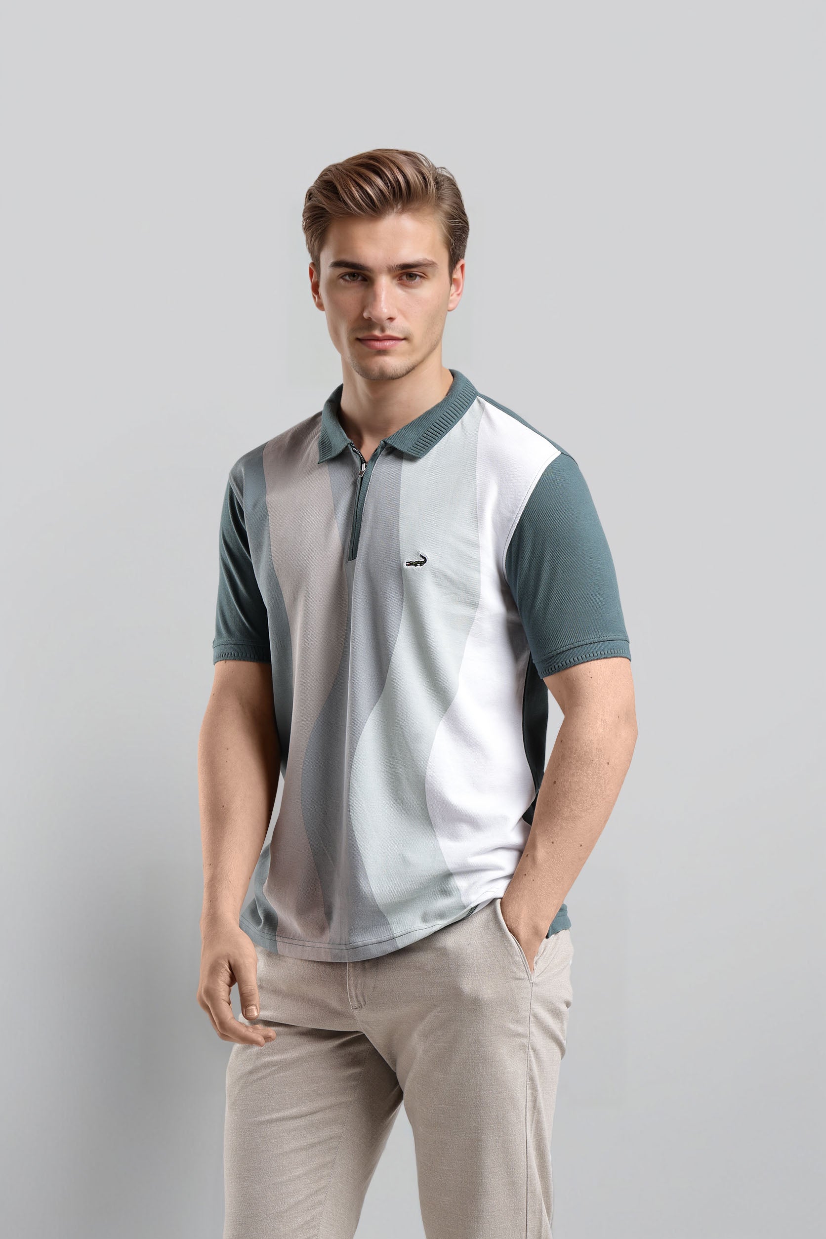 Man wearing a two-tone polo shirt with a plain background
