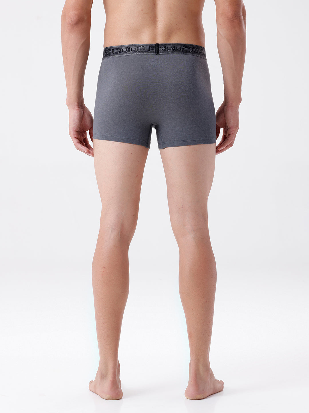 Person wearing gray boxer briefs on a white background