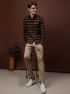 Man wearing a maroon checked full sleeve 100% cotton shirt on a light gray background