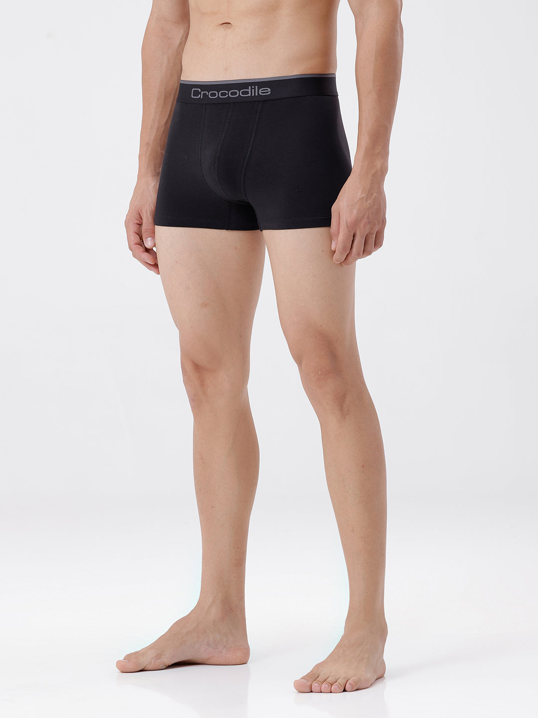 Person wearing black boxer briefs with 'Crocodile' branding on a white background