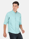 Man wearing a blue aqua blue printed full sleeve shirt with casual styling on a gray background