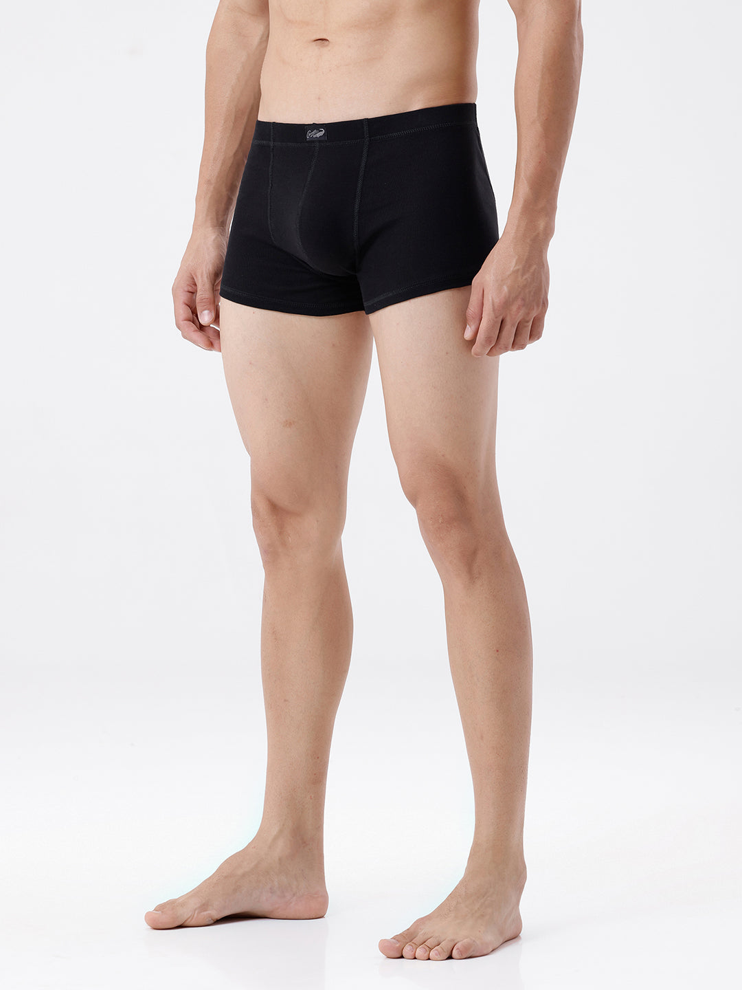 Person wearing black boxer briefs on a white background