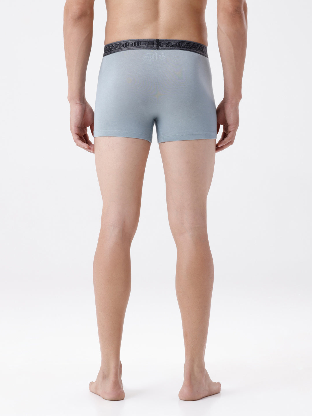 Person wearing light blue boxer briefs on a white background